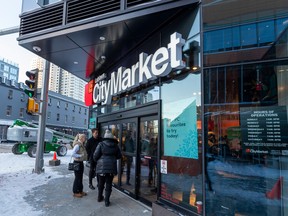 The ICE District Loblaws City Market opens its doors as the store celebrates its grand opening on Wednesday, Nov. 9, 2022, in Edmonton.