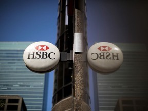 HSBC Holdings PLC signage outside a bank branch in the financial district of Toronto.