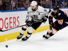 The Edmonton Oilers' Darnell Nurse (25) battles the Los Angeles Kings' Drew Doughty (8) during first period NHL action at Rogers Place in Edmonton, Wednesday Nov. 16, 2022. Photo By David Bloom