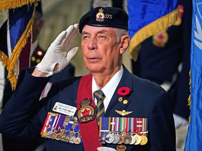 Royal Canadian Legion member Mack Torrie salutes during the  Service of Remembrance held at the Alberta legislature on Thursday, Nov. 3, 2022.