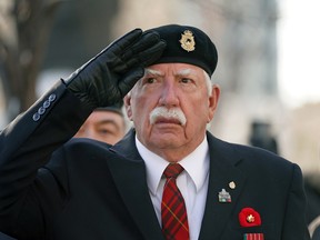 War veteran Bob Karn salutes during a Remembrance Day ceremony in front of Edmonton City Hall on Friday November 11, 2022.