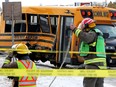 Emergency crews continue to work at the scene of a collision between a school bus and a semi-truck in the Golden Spike Road and Diamond Avenue intersection in Spruce Grove on Friday, Nov. 4, 2022.
