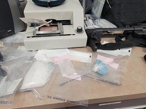 Amy Actimichuk, 38, and Dustin Orvis, 35, both residents of St. Albert, were arrested and charged for possession of drugs, firearms and property obtained by crime. Both were remanded in custody and will appear in St. Albert provincial court on Nov. 28, 2022. supplied
