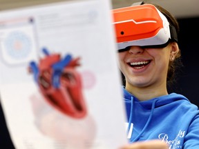 16-year-old Hannah Abdo uses a virtual reality headset to view the human heart as she attends the annual SET conference at the University of Alberta in Edmonton on Saturday, November 26, 2022. Attended events exploring science, engineering and technology (SET) education and career options throughout Alberta.