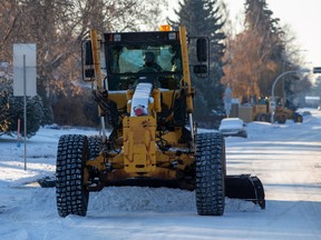 A grader clears the street in Ottewell as the City of Edmonton continues with its Phase 1 Parking Ban on Thursday, Nov. 10, 2022 .