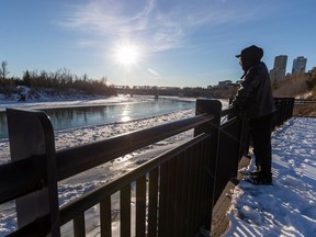 Alan Chen overlooks the North Saskatchewan River on Monday, November 14, 2022, as temperatures in Edmonton are expected to hit 2 degrees Celsius.