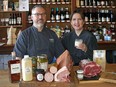 The Butchery owners Blair Lebsack, left, and Caitlin Fulton, owners of The Butchery, with some locally-sourced Christmas dinner products at their Edmonton shop.