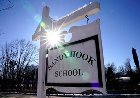 A sign for Sandy Hook Elementary School in Newtown, Conn., on Dec. 13, 2022.
