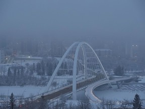 Fog covers the Walterdale Bridge on Friday morning Dec. 30, 2022. Environment Canada issued a fog advisory for the city of Edmonton and surrounding areas the weather is expected to clear up later in the morning.