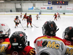 Bow Valley Black and Bow Valley White face off at the Lake Boavista arena during Esso Minor Hockey Week on Jan. 15, 2020.