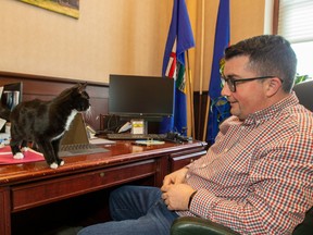 House Speaker Nathan Cooper with Hansard the cat, in his office on Thursday, December 1, 2022 in Edmonton.  Hansard is a rescue cat given to the House Speaker and named after the official legislative record.