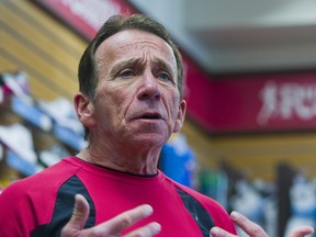 Running Room founder John Stanton speaks at a Running Room store in Vancouver on Feb. 4, 2012. Stanton said the chain's Callingwood South location in Edmonton is closing at the end of 2022.