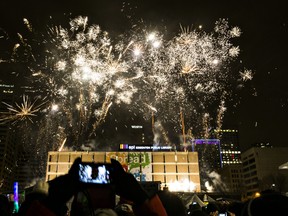Fireworks are launched from Stanley A. Milner Library during New Year's Eve festivities in Sir Winston Churchill Square in Edmonton on Dec. 31, 2014.