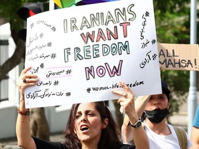 A protester demonstrates in support of rights for Iranian women in Cape Town, South Africa, on Oct. 29, 2022.
