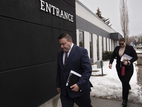 Cpl. Randy Stenger, left, and Const. Jessica Brown, return to court to resume their jury trial on charges of manslaughter with a firearm and aggravated assault, in Edmonton on Friday, Nov. 25, 2022. Closing arguments in the three-week trial are to begin today.