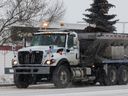 A City of Edmonton sanding truck makes its way through the blowing snow along Mayfield Road near 103 Avenue on Nov. 30, 2022.