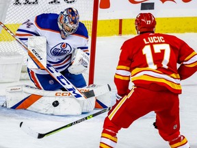 Edmonton Oilers goalie Stuart Skinner with a save on Milan Lucic of the Calgary Flames during NHL hockey at the Scotiabank Saddledome in Calgary on Tuesday, December 27, 2022. AL CHAREST/POSTMEDIA