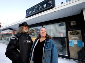 Vern Savage and Kelly Savage outside of their former bar The Gavel Pub, 10217 97 St., in Edmonton on Dec. 20, 2022.