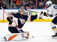 The St. Louis Blues' Ryan O'Reilly (90) looks on as Edmonton Oilers' goaltender Stuart Skinner (74) makes a glove save during second period NHL action at Rogers Place, in Edmonton Wednesday Dec. 14, 2022. Photo By David Bloom