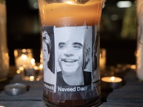 A photo of Naveed Dada, who died in a deadly condo shooting, is displayed on a candle at a vigil for the victims in Vaughan, Ont., on Wednesday Dec, 21, 2022.&ampnbsp;The relative of a man shot dead by a 73-year-old gunman in a condo building north of Toronto says loved ones are to gather for his funeral at a mosque Thursday afternoon. THE&ampnbsp;CANADIAN PRESS/Arlyn McAdorey