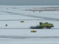 Snow clearing machines work at Vancouver International Airport in Richmond, BC, December, 23, 2022.