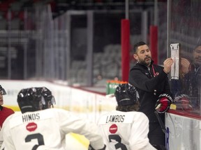 Team Canada World Junior Head Coach Dennis Williams goes over a drill with players during the Canadian World Junior Hockey Championships selection camp in Moncton, N.B., Friday, December 9, 2022.