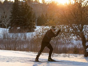 A cross country skier takes advantage of the warm weather as they ski on one of the trails in Gold Bar Park on Wednesday, Dec. 7, 2022, in Edmonton.