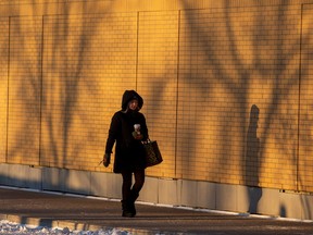 Pedestrians near the Royal Alexandra Hospital are able to enjoy being outside again as the temperatures begin to rise in Edmonton.