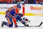 Edmonton Oilers defencemen Philip Broberg (86) reacts after being hit in the face with a puck against the Colorado Avalanche during the second period at Rogers Place.
