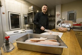 On Thursday, January 5, 2023, at Norwood Legion in Edmonton, recently arrived chef Oleh Durkach from Ukraine works to create traditional Ukrainian Christmas dishes.