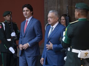 Mexican President Andres Manuel Lopez Obrador walks with Prime Minister Justin Trudeau as he arrives at the National Palace for the North American Leaders Summit Tuesday, January 10, 2023 in Mexico City, Mexico.