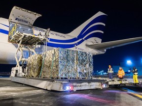 A transport plane is unloaded at the Edmonton International Airport on Jan. 18, 2023, with  the first shipment of children's liquid acetaminophen. 250,000 bottles will be distributed to Alberta hospitals immediately.