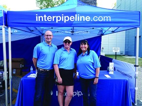 Brooke Kenyon, stakeholder engagement coordinator (middle), with colleagues at Inter Pipeline.   SUPPLIED
