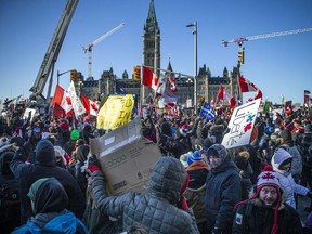 Thousands gather in front of Parliament Hill in central Ottawa on February 5, 2022, to protest against vaccine mandates and other health regulations as part of the Freedom Convoy.