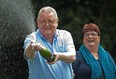 Colin Weir (L) and his wife Chris pose for pictures during a photocall in Falkirk, Scotland, on July 15, 2011.