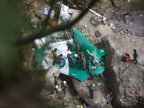 A rescue team recovers the body of a victim from the site of the plane crash of a Yeti Airlines operated aircraft, in Pokhara, Nepal January 16, 2023.