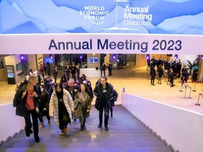 Participants of the World Economic Forum (WEF) 2023 are seen in a hall at Davos Congress Centre, in the Alpine resort of Davos, Switzerland, January 16, 2023.