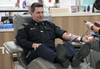 Edmonton Fire Rescue Services Chief Joe Zatylny donates blood in Edmonton on Tuesday, Jan. 3, 2023. Emergency service workers in Edmonton are answering the call to help save lives as part of a month-long Sirens for Life campaign organized by Canadian Blood Services.