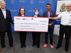 Aaron Perdue, Millennium Insurance Corporation CEO, Ashif Mawji, Edmonton Police Foundation Chair, and Edmonton Police Chief Dale McFee hand local mother and daughter team, Mavis Shaw and Tamara Dolinsky a $25,000 cheque for their product Foilem Fence to deter catalytic converter thefts. Photo supplied by the Edmonton Police Service.