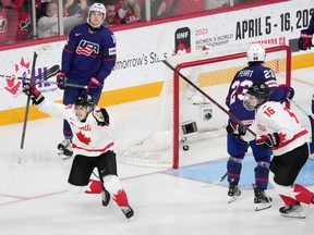 Canada's Logan Stankoven, left, celebrates his goal with teammate Connor Bedard, right, as USA's Jimmy Snuggerud, second from left, and Jack Peart look on during second period IIHF World Junior Hockey Championship semifinal action in Halifax on Wednesday, January 4, 2023.