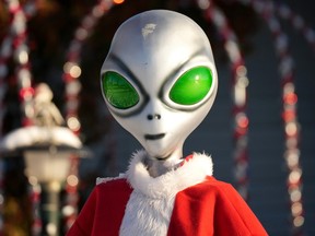 An alien wearing a Santa Claus suit landed on a residential front yard in east Edmonton on Friday, January 6, 2023, just in time for Ukrainian Christmas day on Saturday, January 7, 2023.