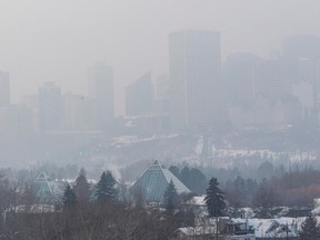 Fog obscures the view of downtown on Tuesday, Jan. 10, 2023, in Edmonton.    Environment Canada has issued a fog advisory and a Special air quality statement that says poor air quality is occurring and will continue through the week.