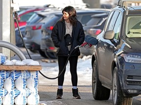 A motorist fills up with gas in southwest Edmonton on Wednesday January 18, 2023. Gas prices in the city increased 10 cents per litre overnight at some stations. The posted gas prices on Wednesday at many stations in the city was $1.31.9 cents per litre.