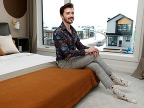 Brandin Strasser, who recently relocated from the greater Toronto area, poses for a photo in an Edmonton showhome, Wednesday, Jan. 11, 2023.