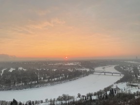A seemingly skeptical sun rises over Edmonton's River Valley Sunday morning, Jan. 15, 2022. Craig Gilbert/POSTMEDIA
