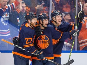 Depth scoring is becoming a regular occurrence for the Edmonton Oilers. Here Brett Kulak, Derek Ryan and Dylan Holloway share a celly.