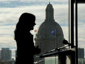 The dome of the Alberta Legislature is visible in the background as Alberta NDP leader Rachel Notley speaks about public and private healthcare during a press conference in Edmonton, Tuesday, Jan. 24, 2023.