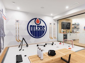 The workout room in the Edmonton Oilers fan cave, by Coventry Homes.