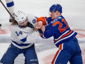 Edmonton Oilers Klim Kostin (21) fights with Tampa Bay Lightning Pat Maroon (14) during second period NHL action on Thursday, Jan. 19, 2023 in Edmonton. Greg Southam-Postmedia