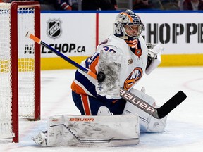 The New York Islanders' goalie Ilya Sorokin (30) makes a blocker save against the Edmonton Oilers during first period NHL action at Rogers Place, in Edmonton Thursday Jan. 5, 2023.